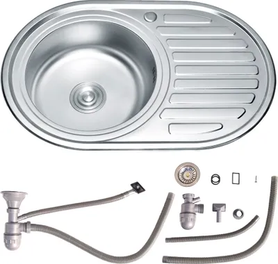 A stainless steel kitchen sink and its plumbing accessories are displayed against a white background.