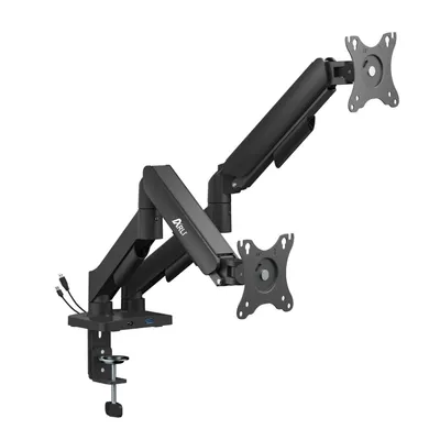 A black dual monitor mount with gas spring arms, clamped to a desk edge.