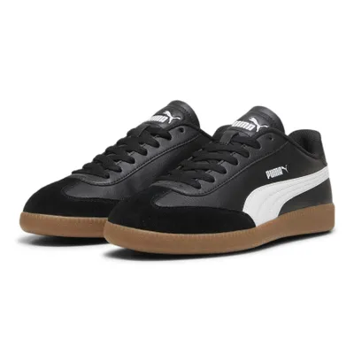 A pair of black Puma sneakers with white accents and a brown sole, shown from a slightly angled front view on a white background.