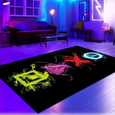 A gaming-themed room with a rug featuring neon-colored gaming controller symbols.