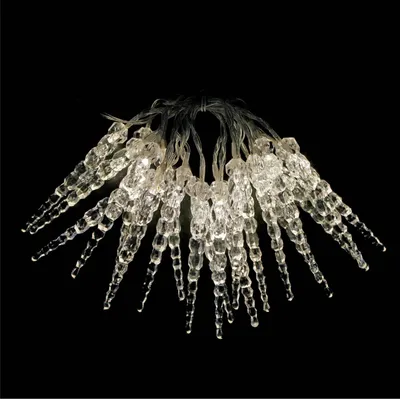 A string of icicle-shaped LED lights against a black background.