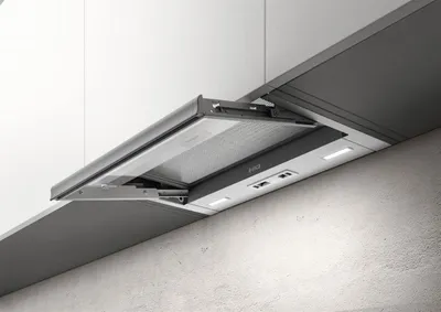 A close-up shot of an under-cabinet range hood, partially extended.