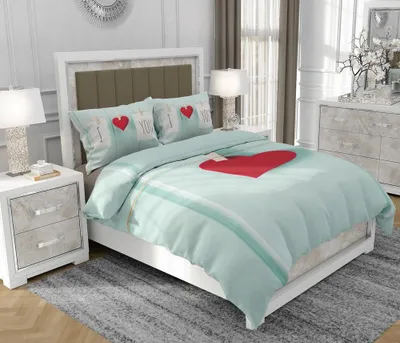 A bedroom scene with a bed made up with bedding.