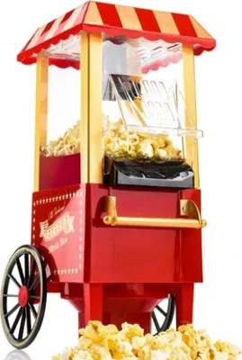 A red and gold retro-style popcorn machine filled with popcorn.