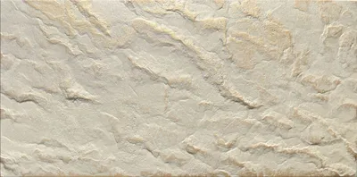 A close-up view of textured beige and gold wall panels with a stone-like appearance.