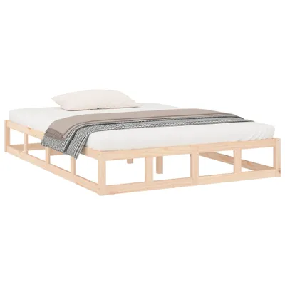 A wooden bed frame with a mattress, pillow, and blanket.