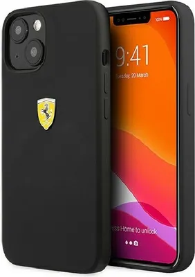 A black iPhone 13 Pro Max with a Ferrari logo on the back, shown at an angle next to its screen.