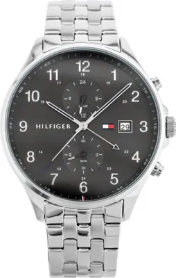 A close-up studio shot of a Tommy Hilfiger men's watch against a white background.