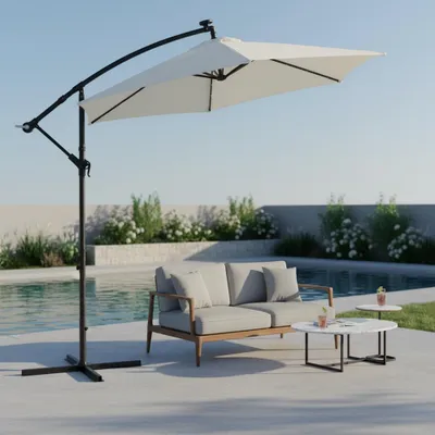 An outdoor patio scene with a sofa, coffee tables, and a large cantilever umbrella next to a swimming pool.