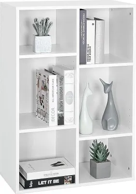A white cube bookshelf with various decorative items and books on its shelves.