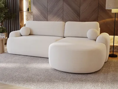 A modern white sectional sofa is shown in a living room setting with a wooden accent wall and a plush gray carpet.