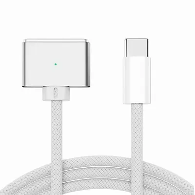 A white USB-C to MagSafe 3 charging cable with a white braided cord and a silver magnetic connector with a green LED light.