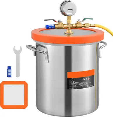 A vacuum chamber with a tempered glass lid, pressure gauge, and accessories, displayed on a white background.