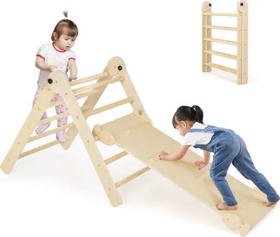 Two children playing on a wooden climbing toy set.