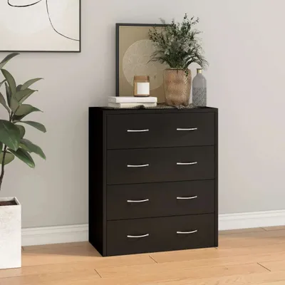 A black chest of drawers with four drawers is shown in a room setting. There are decorative items on top of the dresser, and a plant is to the left.