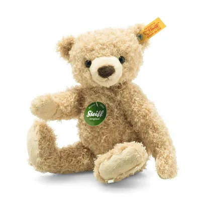 A beige teddy bear sitting on a white background.