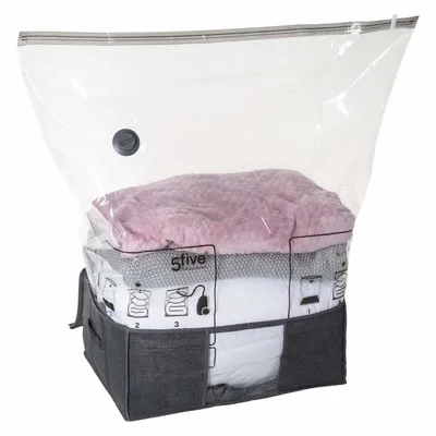A vacuum storage bag filled with folded blankets and textiles, shown on a white background.