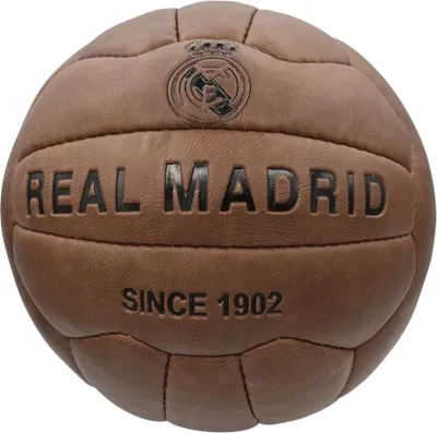 A vintage-style brown leather soccer ball with the Real Madrid logo and text.