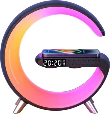 A modern bedside lamp with a built-in wireless charger and clock, displaying a colorful gradient light.