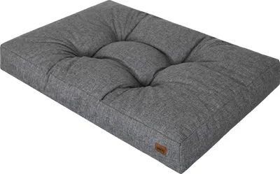 A gray rectangular dog bed with tufted cushioning, shown from a slightly elevated side angle on a white background.