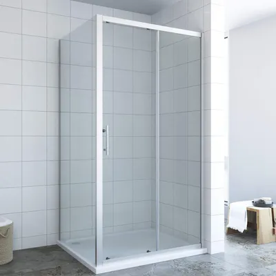 A modern shower enclosure in a tiled bathroom.