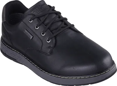A single black men's shoe is shown from a slightly elevated diagonal angle against a white background.