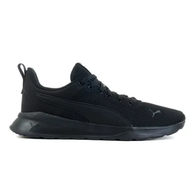 A black Puma sports shoe is shown against a white background.