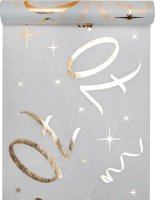 A roll of white and gold table runner with '70' printed on it, along with stars and confetti.