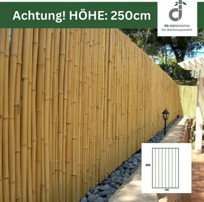 A tall bamboo fence with a pathway and stones in the foreground, and a small diagram showing dimensions in the bottom right corner.