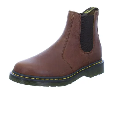 A single brown Dr. Martens Chelsea boot is shown against a white background.