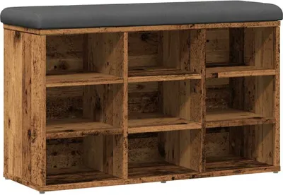 A shoe bench with multiple compartments and a padded top.
