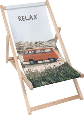 A beach chair with a printed image of an orange van on a sandy beach.