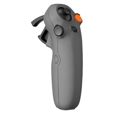 A gray drone controller with an orange button is shown against a white background.