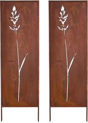 Two identical metal garden screens with a cut-out design of a grass stalk, standing on white legs.