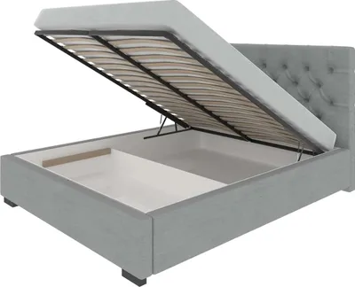 A bed frame with the mattress support lifted to reveal storage space.