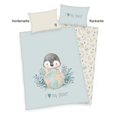 A bedding set with a penguin illustration on a light blue background, shown with a pillow.