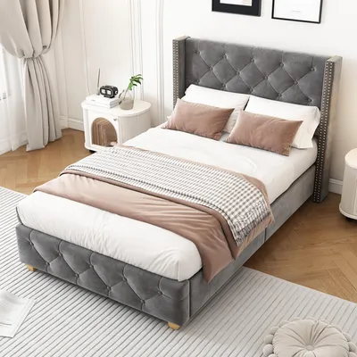 A bedroom scene with a bed, nightstand, and curtains.