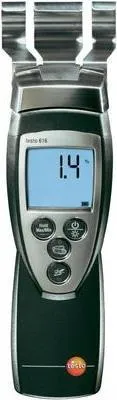A handheld device with a digital display and metal probes at the top.
