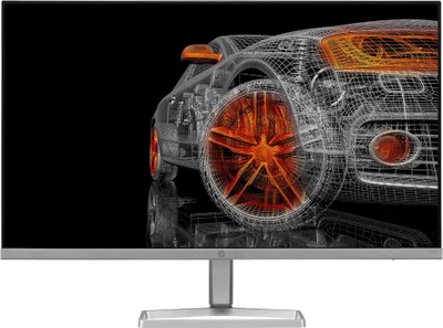 A wireframe rendering of a car on a black background, displayed on a monitor.