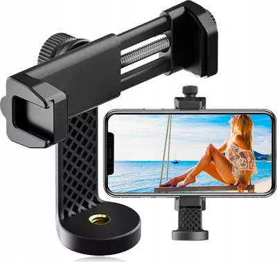 A smartphone holder attached to a tripod mount, with a smartphone displaying a beach scene.