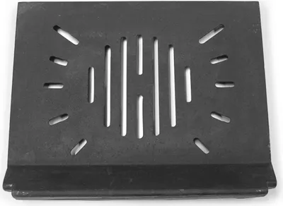 A black metal grate with slots, likely a spare part for a fireplace.