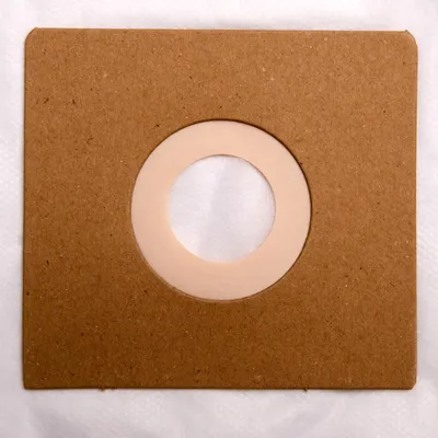 A close-up view of a vacuum cleaner bag with a circular opening.