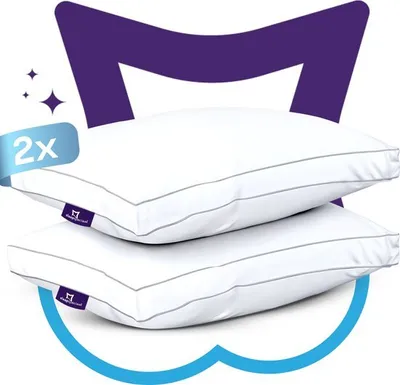 Two white pillows stacked on top of each other, with a purple graphic element behind them and a blue cloud-like graphic element below.