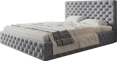A tufted upholstered bed frame with a headboard and mattress, shown from a side angle against a white background.