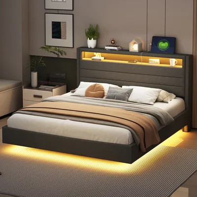 A modern bedroom with a bed, nightstand, and wall art.
