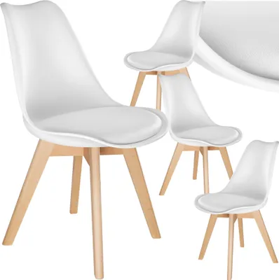 A set of four white dining chairs with wooden legs, arranged on a white background.