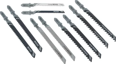 A collection of jigsaw saw blades laid out on a white background.