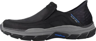 Side view of a black Skechers slip-on shoe with a gray sole.