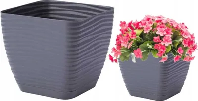 Two square planters, one empty and one with pink flowers.