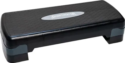 A black and gray fitness stepper is shown on a white background.